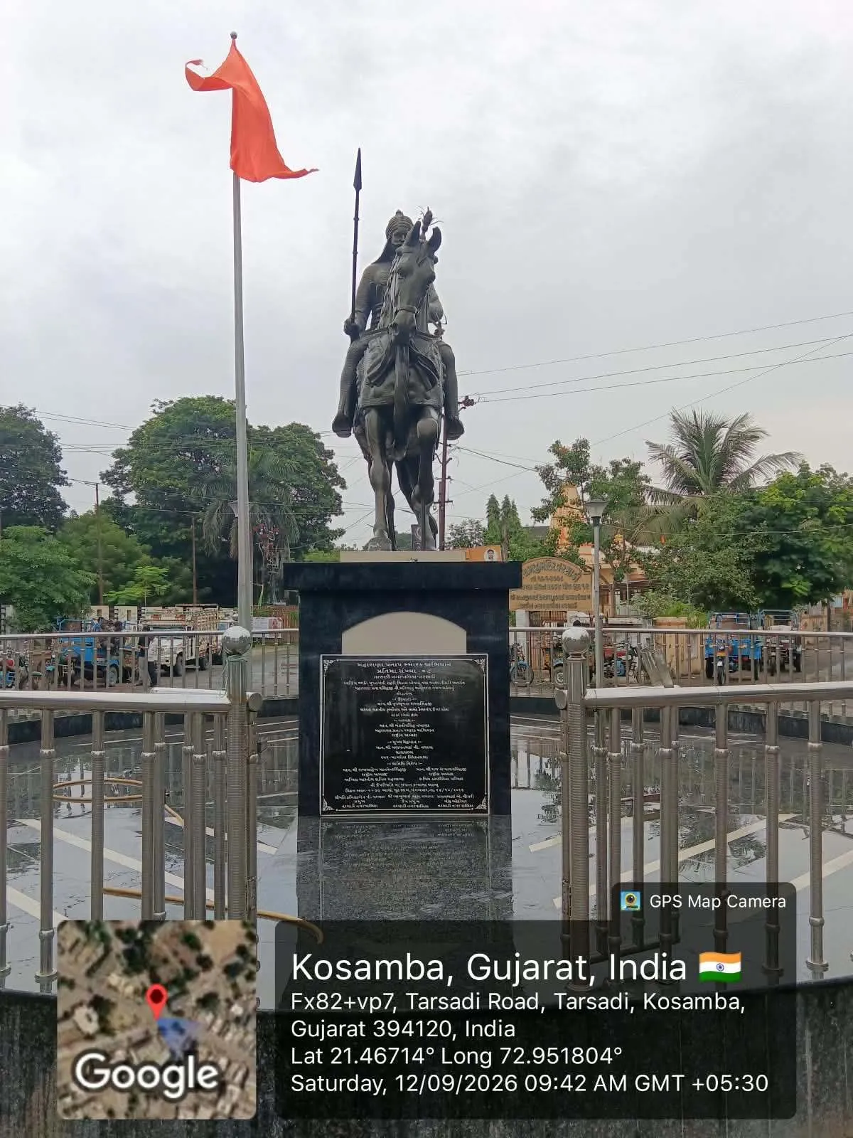 An equestrian memorial statue in a maintained public square at Kosamba