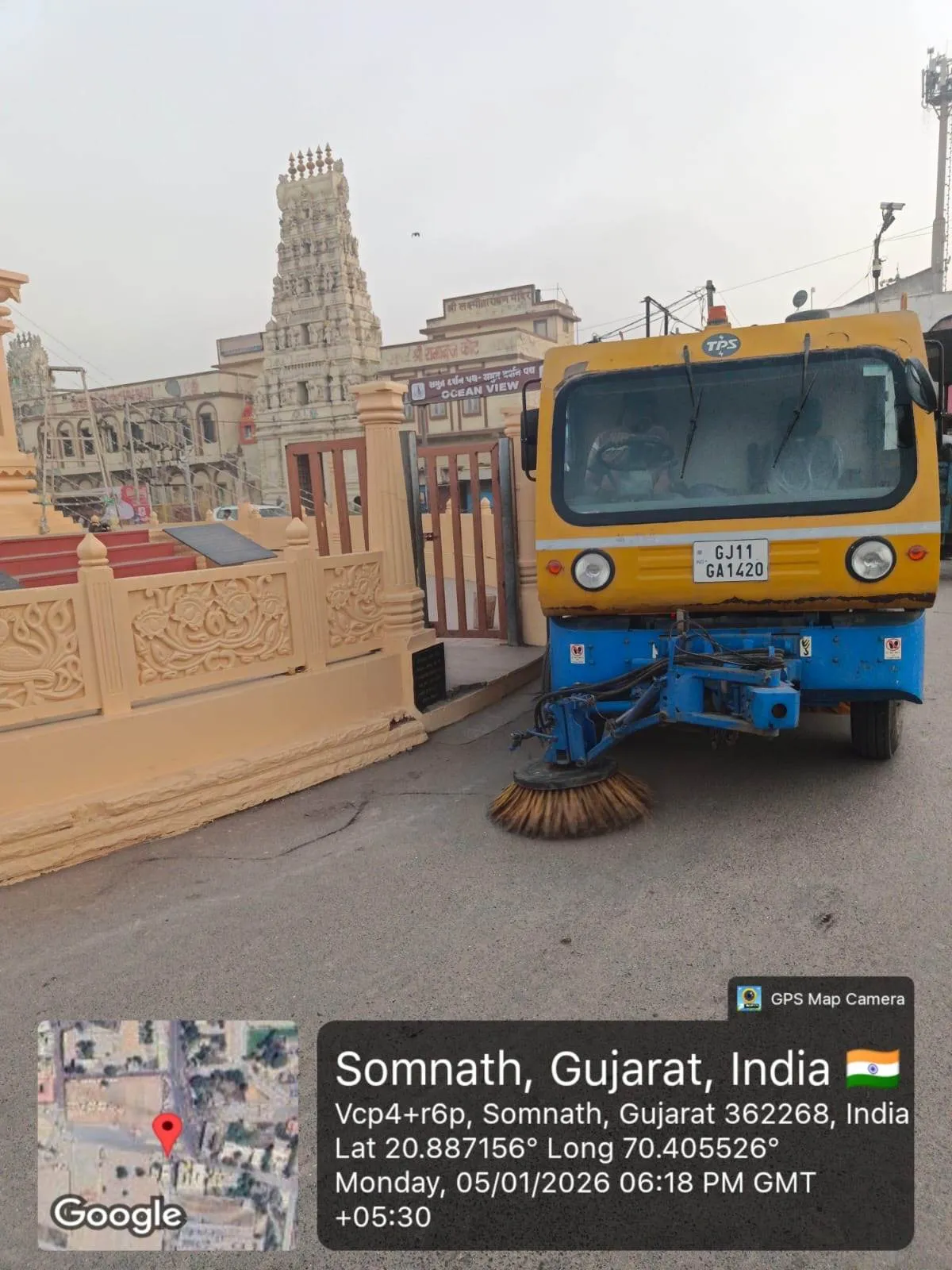 A mechanical road sweeper working the approach road beside the temple complex at Somnath