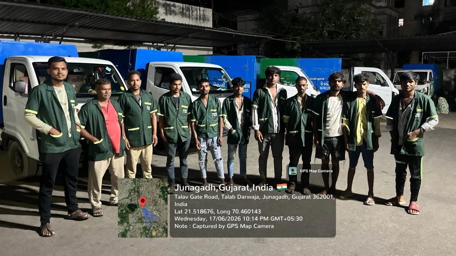 The J Kachrewala team in green jackets photographed together in front of the collection fleet at Junagadh